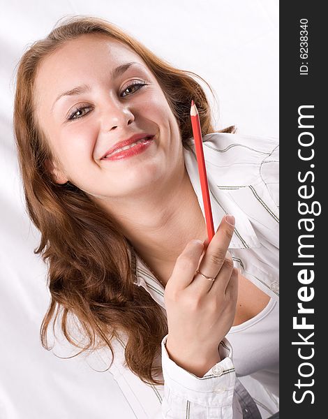 Beautiful girl posing with crayon. White background. #1. Beautiful girl posing with crayon. White background. #1