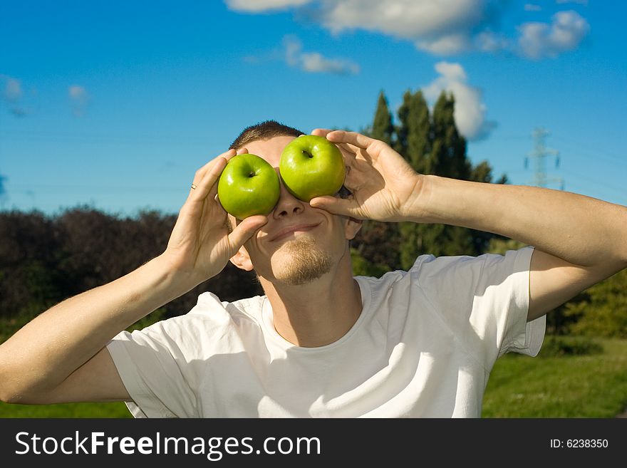 Man with tasty green apples. Man with tasty green apples