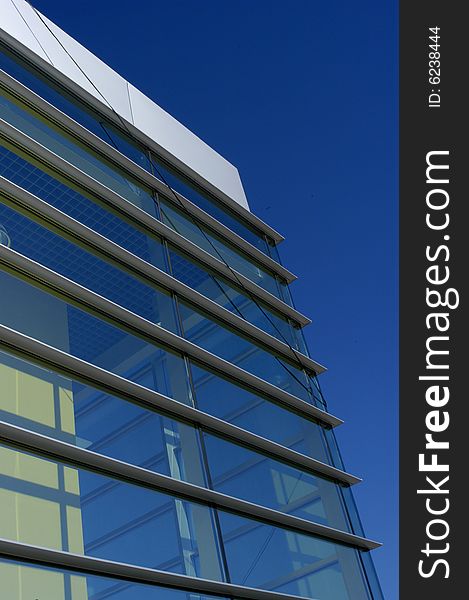 Perspective of a modern house over a clean blue sky. Perspective of a modern house over a clean blue sky