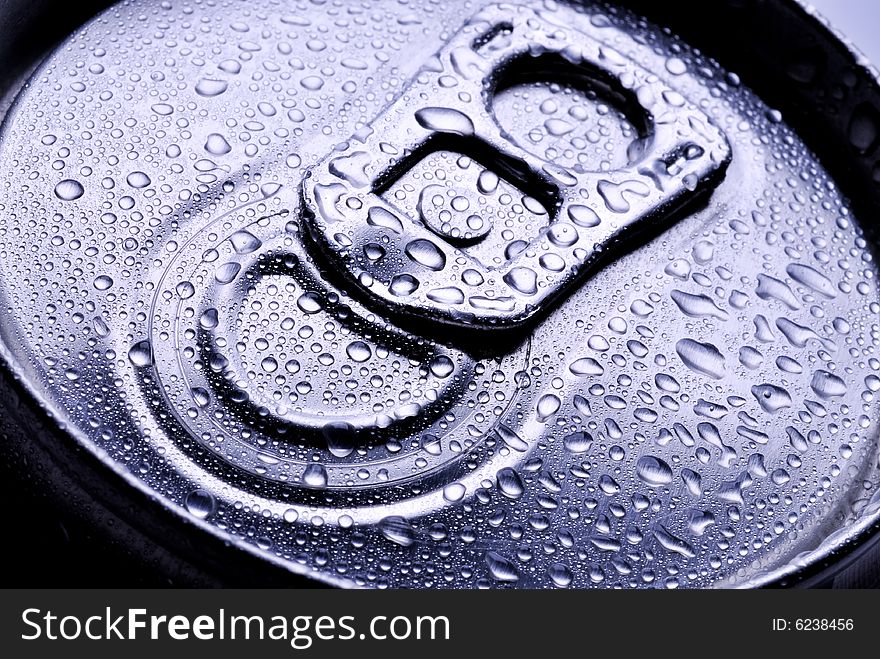 Close up of a metal pop top from a beverage can with drops. Close up of a metal pop top from a beverage can with drops