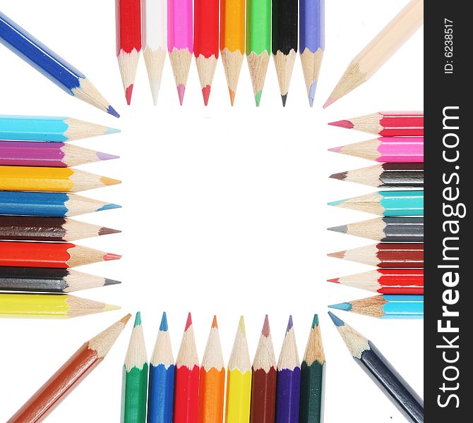 Colored pencils form a square white space in center. Colored pencils form a square white space in center