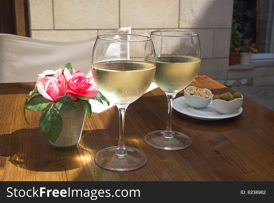 Table with flowers in summer cafe. Table with flowers in summer cafe