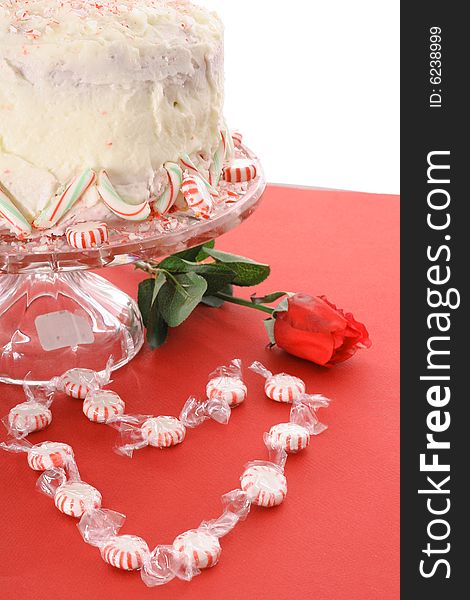 Pepperint cake with a rose isolated