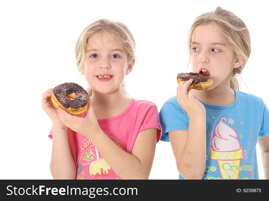 Child Looking At Sister Eating A Doughnut