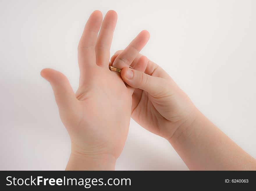 HAnds turning a wedding wring with worry. HAnds turning a wedding wring with worry