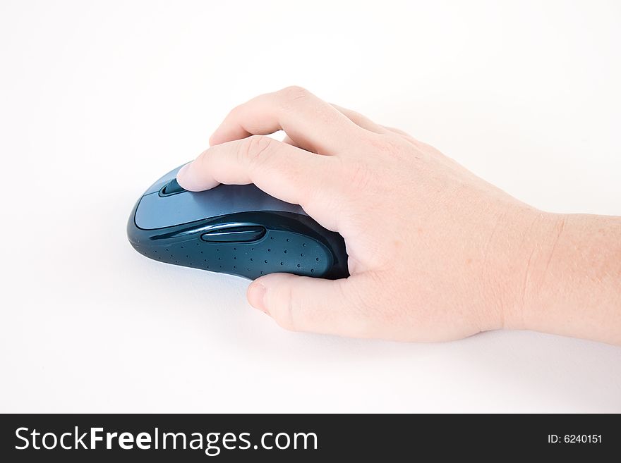 Hand with a computer mouse against a white background. Hand with a computer mouse against a white background