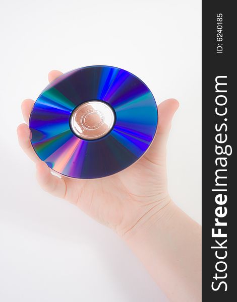 A hand holding a dvd against an isolated white background