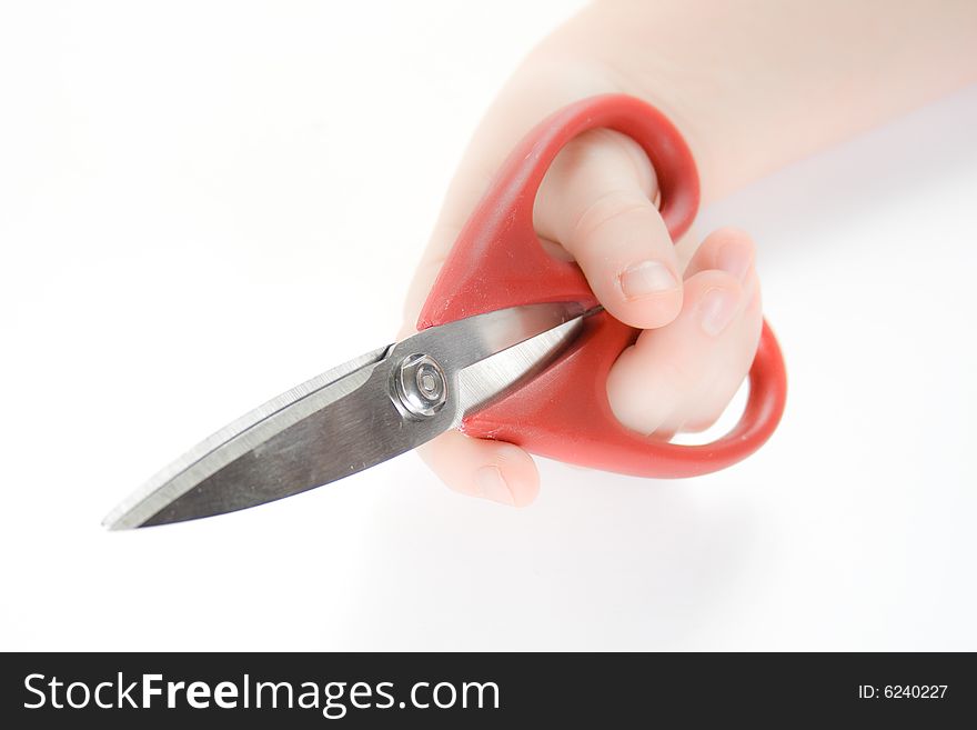 Woman holding scissors against a white background