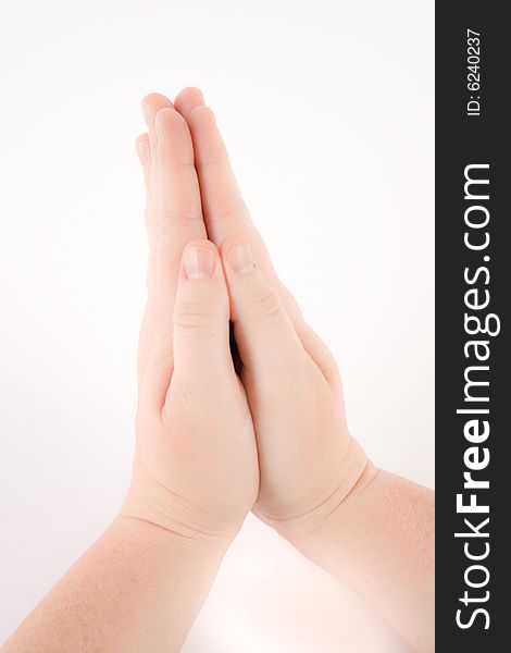 Woman's hands clasped or folded in prayer