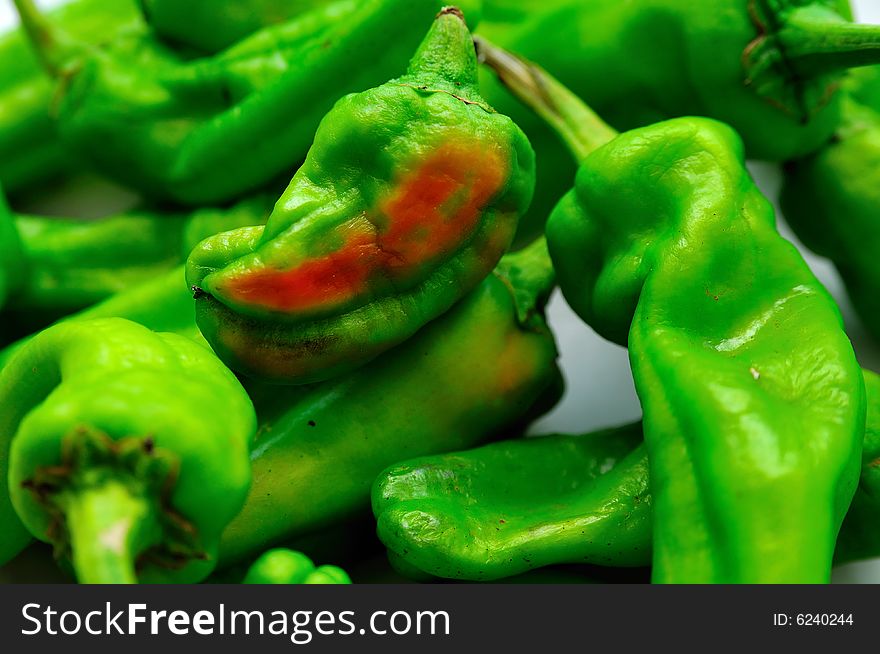 Green little non piquant raw peppers from the orchard. Green little non piquant raw peppers from the orchard