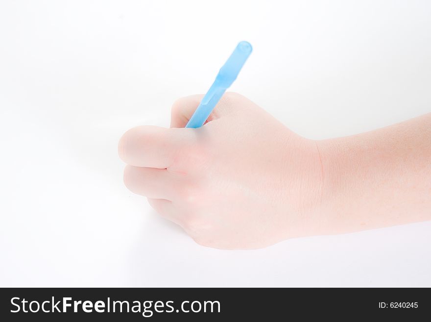 A hand holding a pen with her left hand against a white background