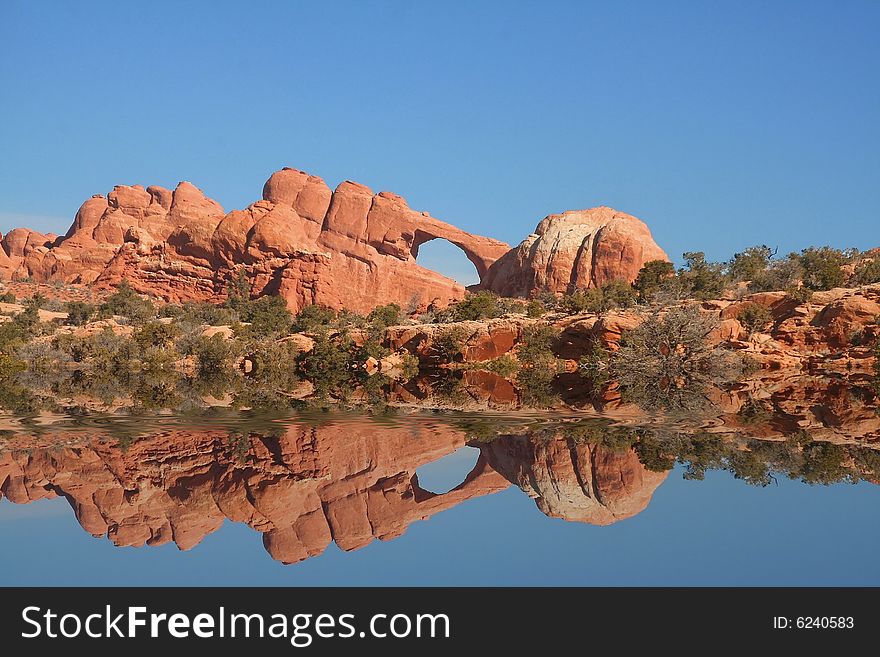 View of the red rock formations in Arches National Park with blue Skys. View of the red rock formations in Arches National Park with blue Skys