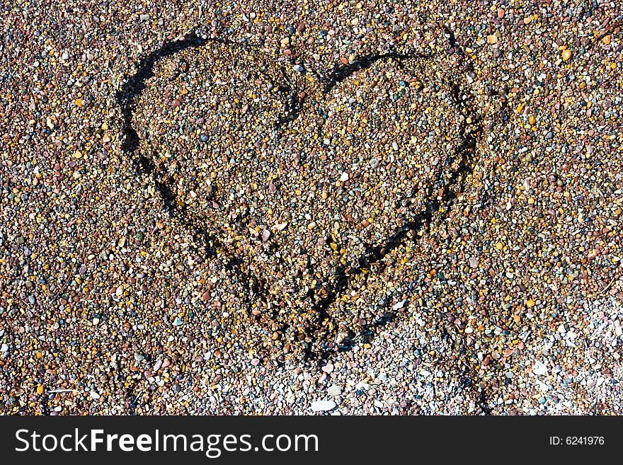 Painted heart on the sand