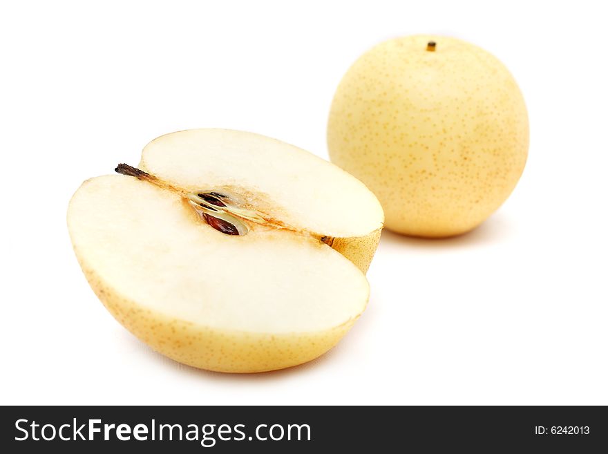 Nashi pear sliced into half on white background. Nashi pear sliced into half on white background.