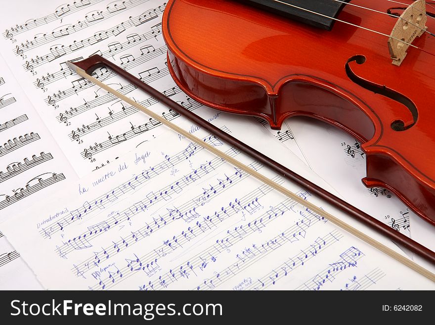 Old violin with notes, background. Old violin with notes, background