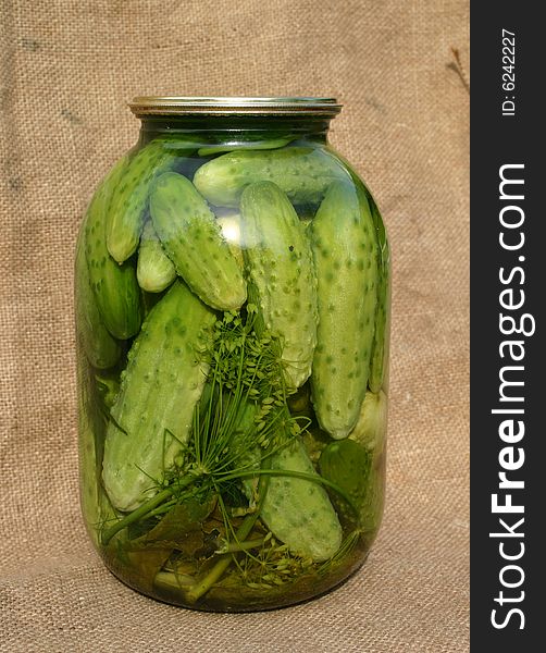 Salty pickled cucumbers in banks