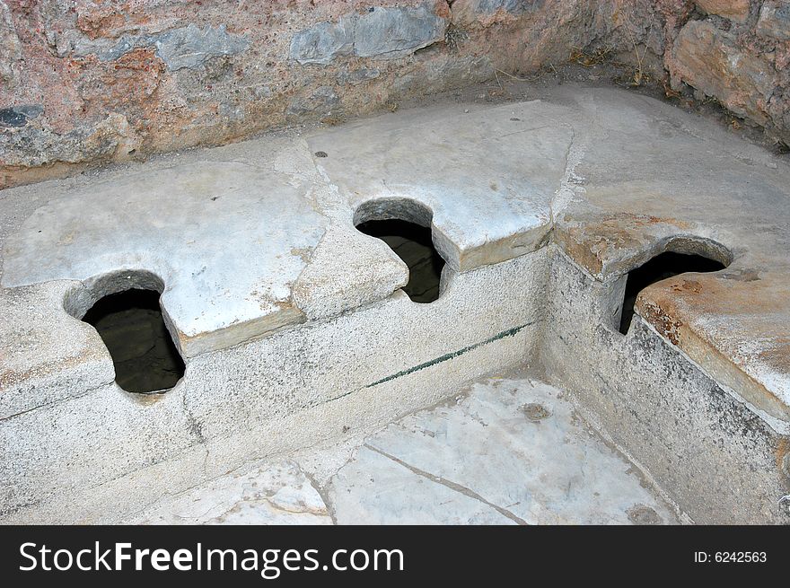 Close-up image of marble toilette in ancient city Ephesus, Turkey