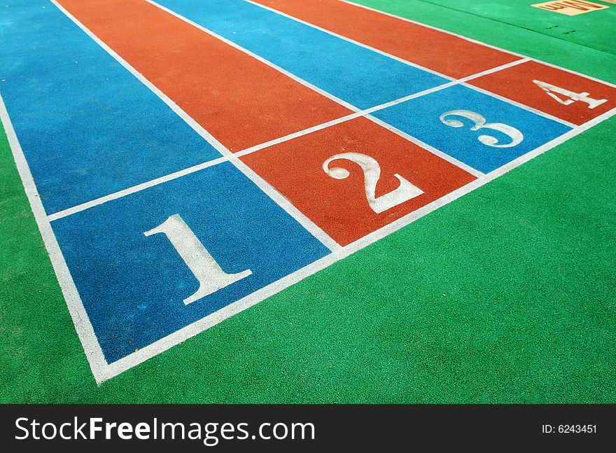 The colorful courses with white numbers on the playground.