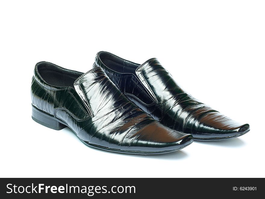 Man's black shoes isolated on clear white background with shadow