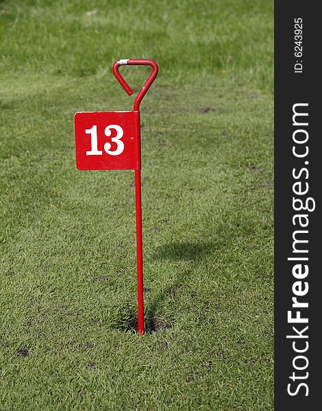 On the fun golf course is the hole thirteen which is luck for some. On the fun golf course is the hole thirteen which is luck for some