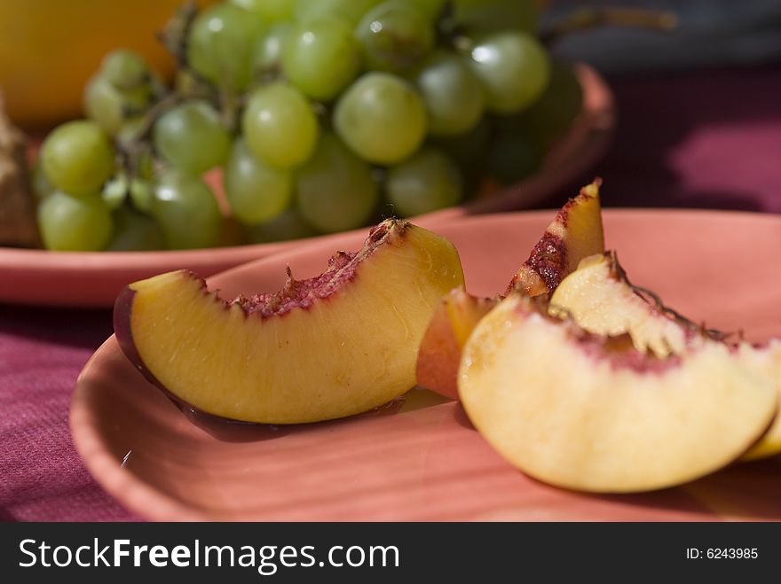Summer fruits plate - nectarine, grape