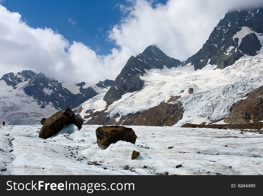 Big rock on glacier in Caucasus mountains