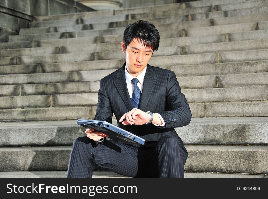 Picture of a Young Successful Looking Executive waiting. Suitable for lifestyle, career type of contexts. Picture of a Young Successful Looking Executive waiting. Suitable for lifestyle, career type of contexts.