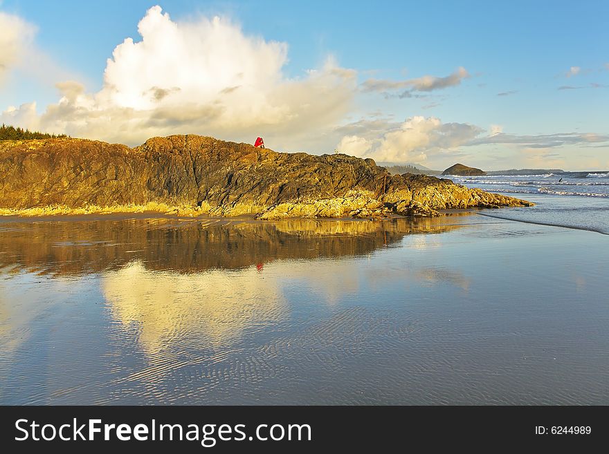 The guy and the girl admire a magnificent sandy beach at coast of Pacific ocean. The guy and the girl admire a magnificent sandy beach at coast of Pacific ocean