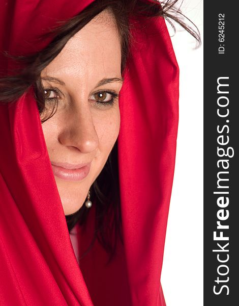 Caucasian young adult woman covering her head with red satin