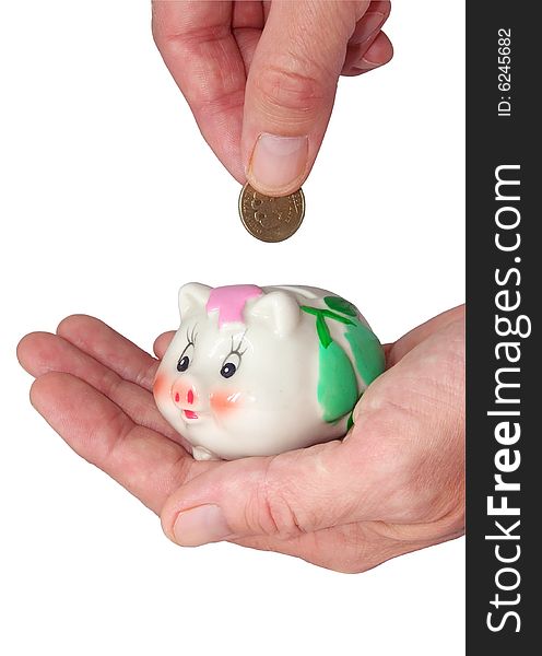Deposits coin in piggy bank on white of bakgraund