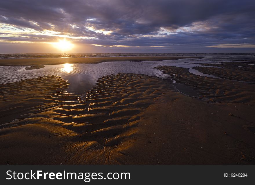 Beautiful sunset and waves on the beach