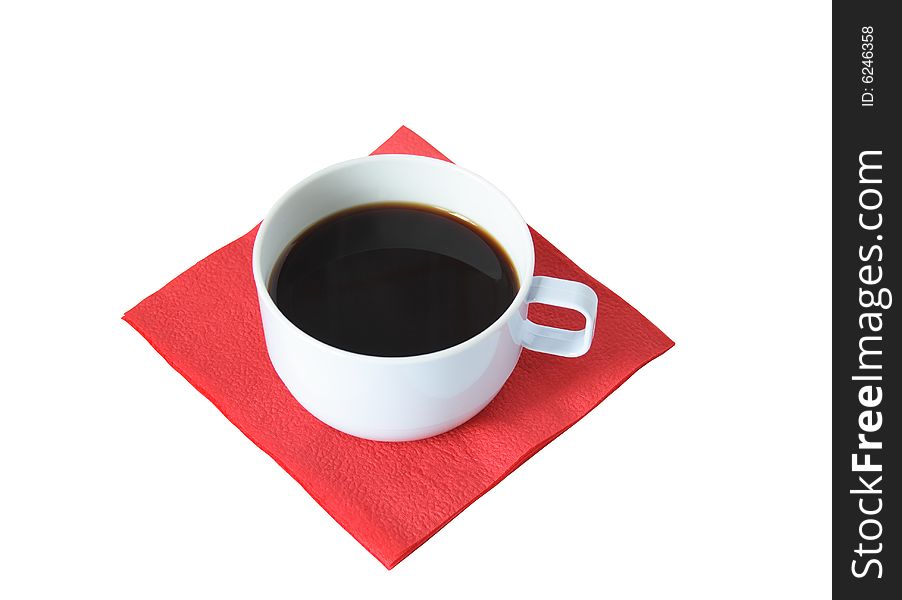 Cup of black coffee standing on red paper napkin on white background