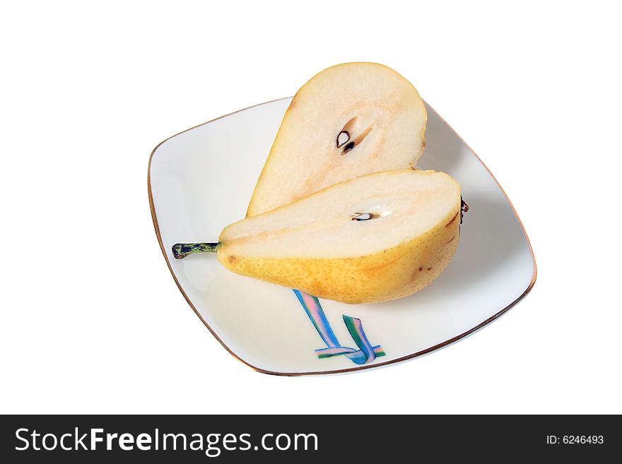 Slit pear lying on nice plate on white background