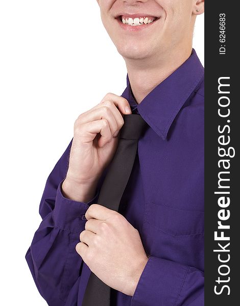 Young successful businessman wearing an office shirt and fixing his tie. Isolated on white background. Young successful businessman wearing an office shirt and fixing his tie. Isolated on white background