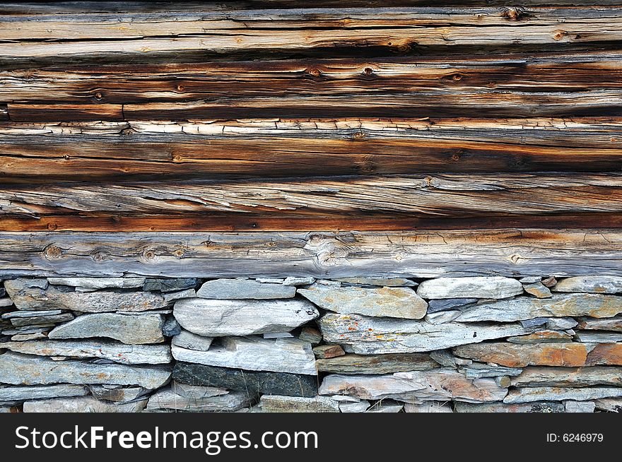 Log home old wall and stones base. Log home old wall and stones base
