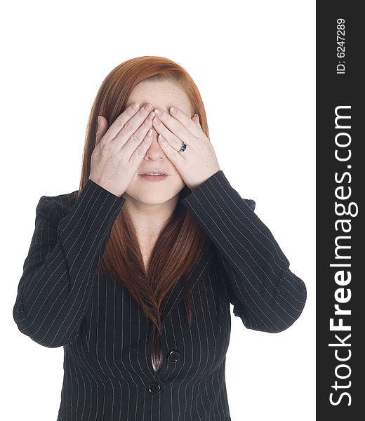 Isolated studio shot of a businesswoman in the See No Evil pose. Isolated studio shot of a businesswoman in the See No Evil pose.