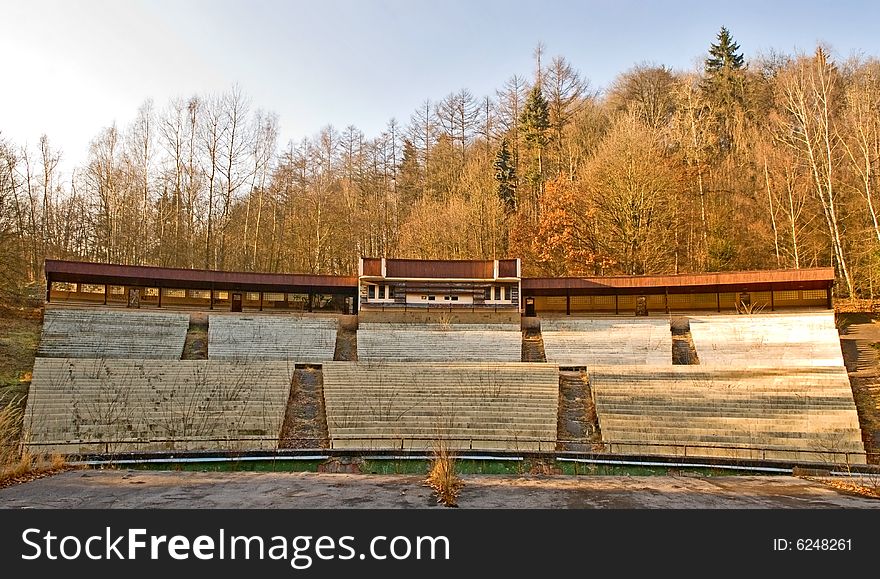 Wooden theatre in Autumn outdoor. Kind from viewing benches