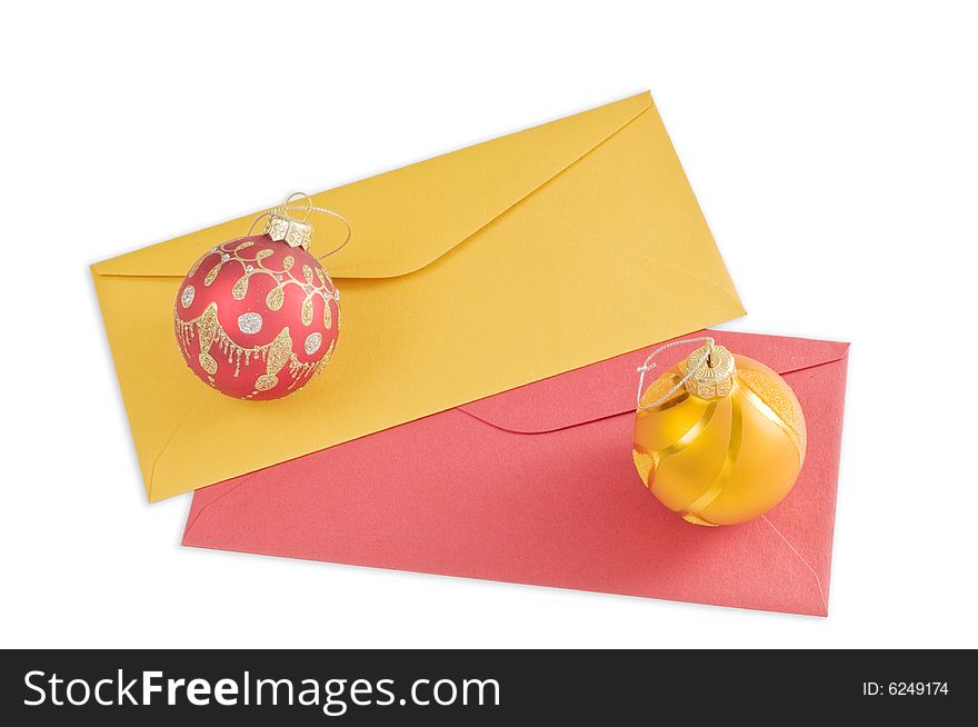 Two envelopes and christmas balls isolated on white background
