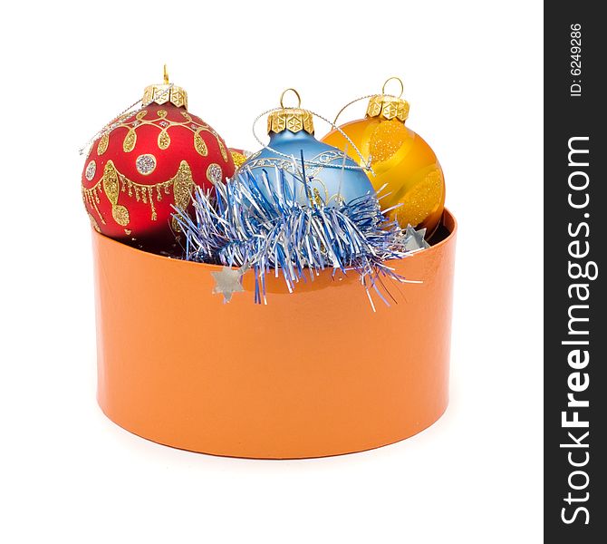 Christmas balls in orange box  on the white background