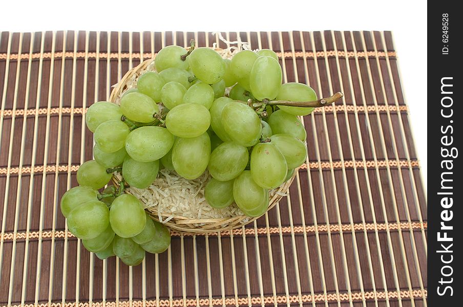Grapes in a basket on a napkin