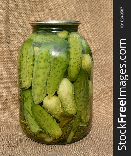 Salty pickled cucumbers in banks. Salty pickled cucumbers in banks