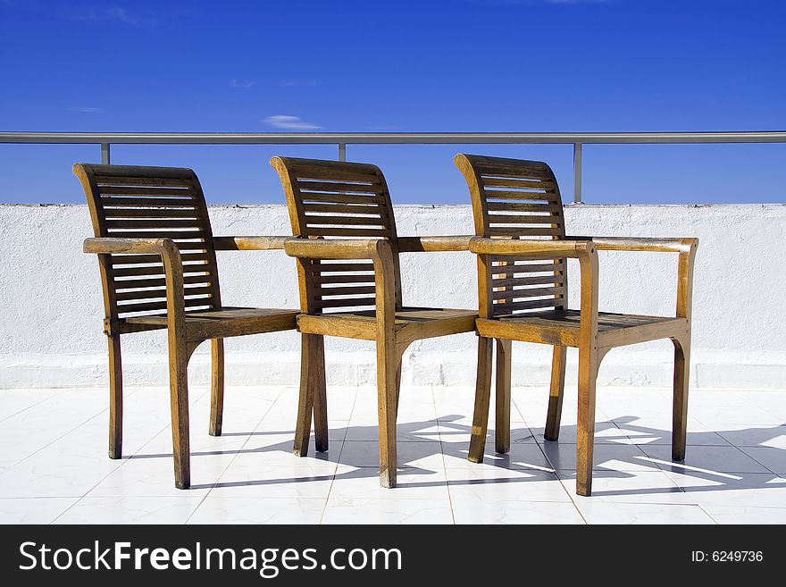 Three chair on balcony (summer)