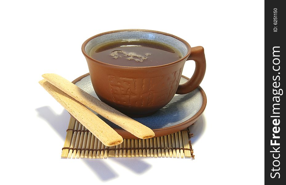 Ceramic cup of tea and cookies isolated on white. Ceramic cup of tea and cookies isolated on white