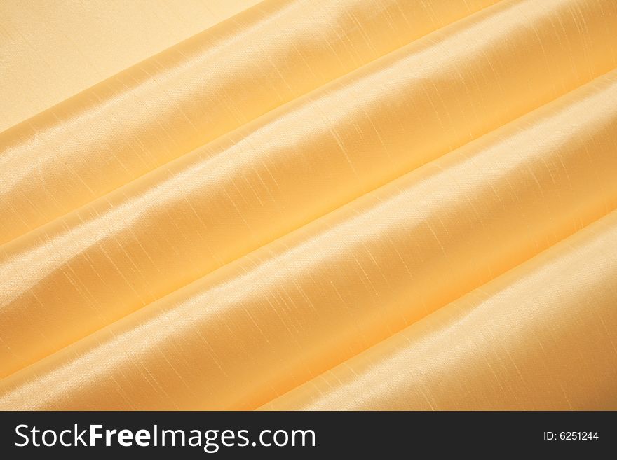 Grunge gold silk fabric textured striped background