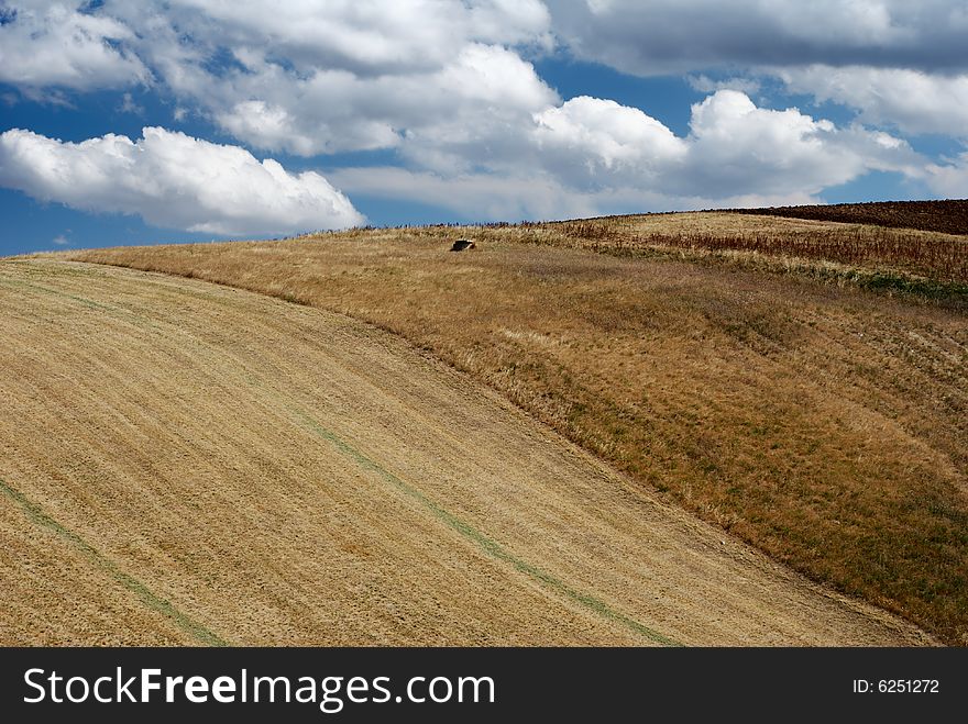 Arid hills in summertime with moody sky