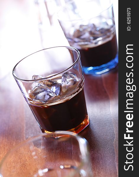 Espresso shot with crema and icecubes. Espresso shot with crema and icecubes