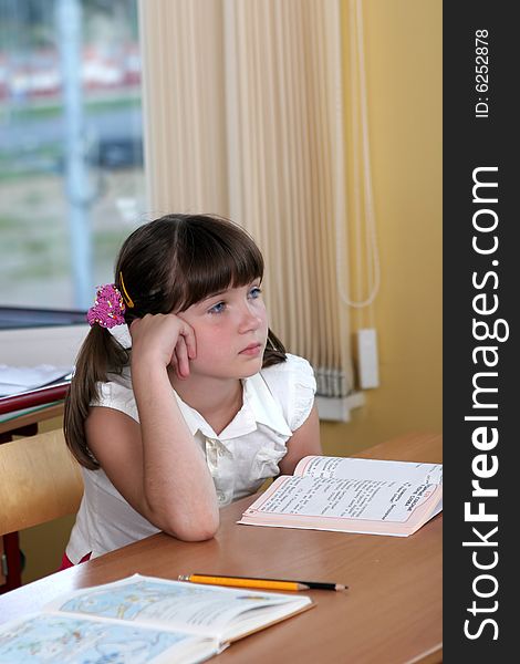 The beautiful girl with blue eyes at a  lesson. The beautiful girl with blue eyes at a  lesson.