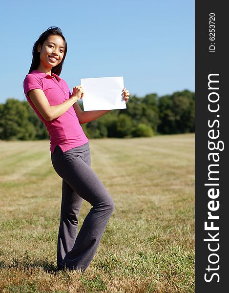 Girl With Blank Sign In Field