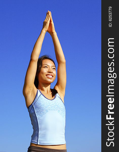 Girl Practicing Yoga In Field