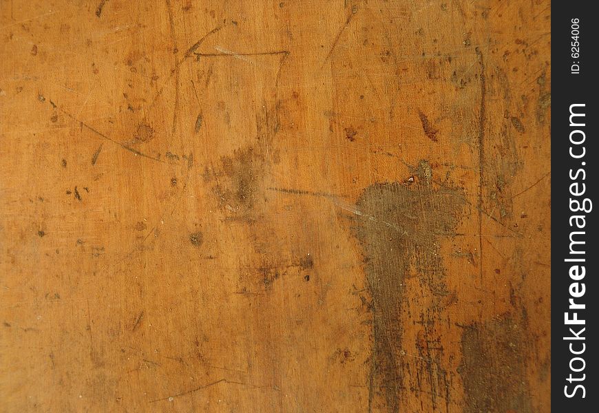 Scrapped and scratched light colored wooden surface. Scrapped and scratched light colored wooden surface
